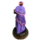 Terreiro Chão de Oya Nana Orixá resin statue in purple with pink bow and gold trim, back view of handmade figurine.